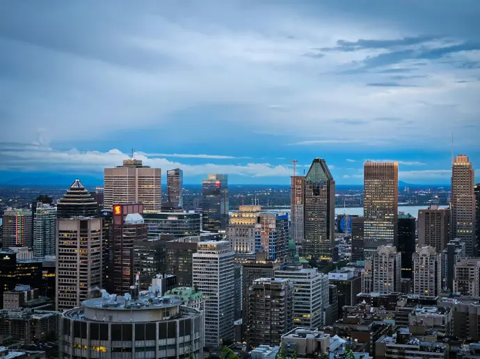 A view of a city at night from the top of a building